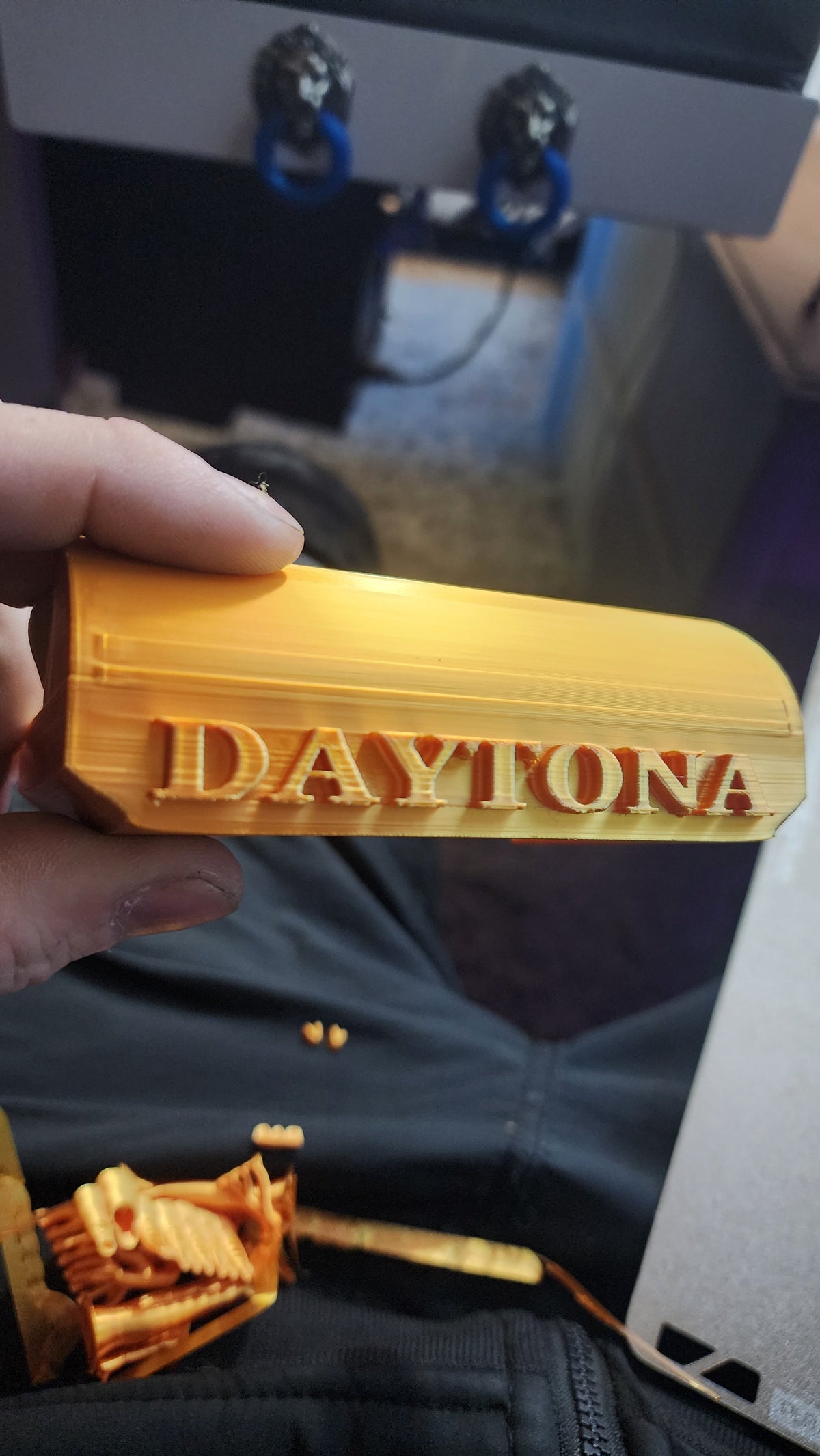 A 3d printed glare shield for the Hooga Daytona electric scooter, printed in gold PLA+. 