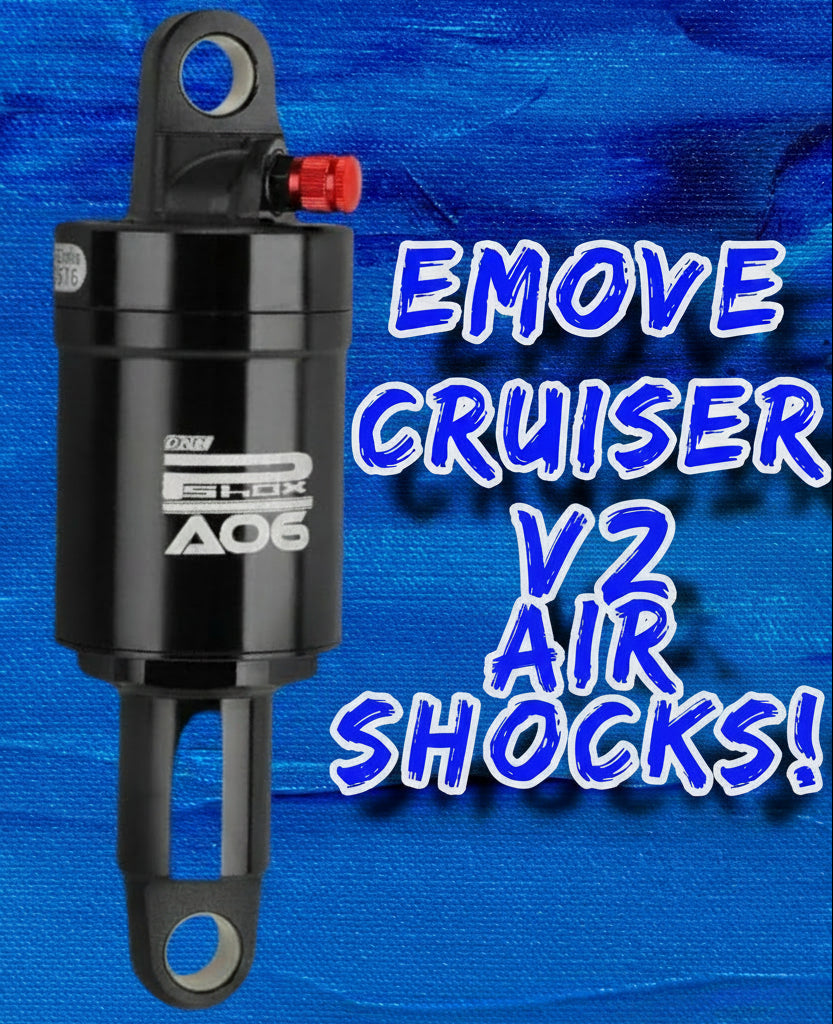 Black air shock absorber with 'EMOVE CRUISER V2 AIR SHOCKS' text on a blue background