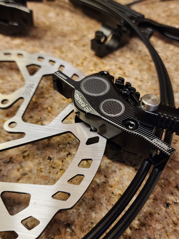 quad piston brake caliper on rotor
